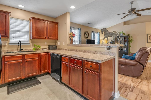 kitchen with lofted ceiling, sink, dishwasher, kitchen peninsula, and ceiling fan