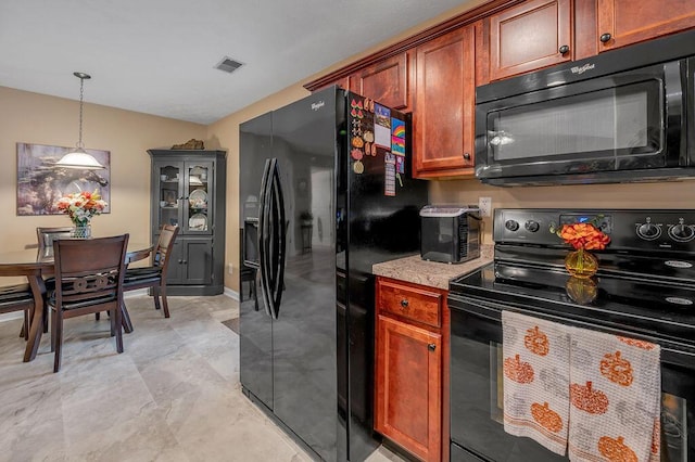 kitchen with decorative light fixtures and black appliances