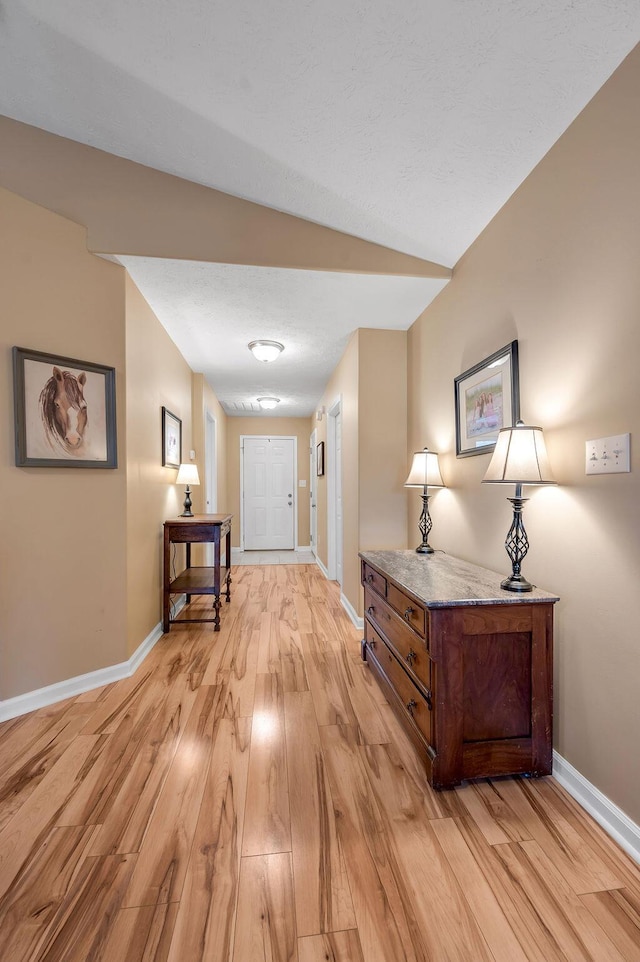 hall with light wood-type flooring