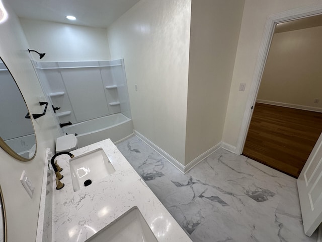 bathroom featuring vanity, hardwood / wood-style floors, and bathing tub / shower combination