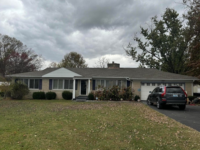 single story home with a front lawn and a garage