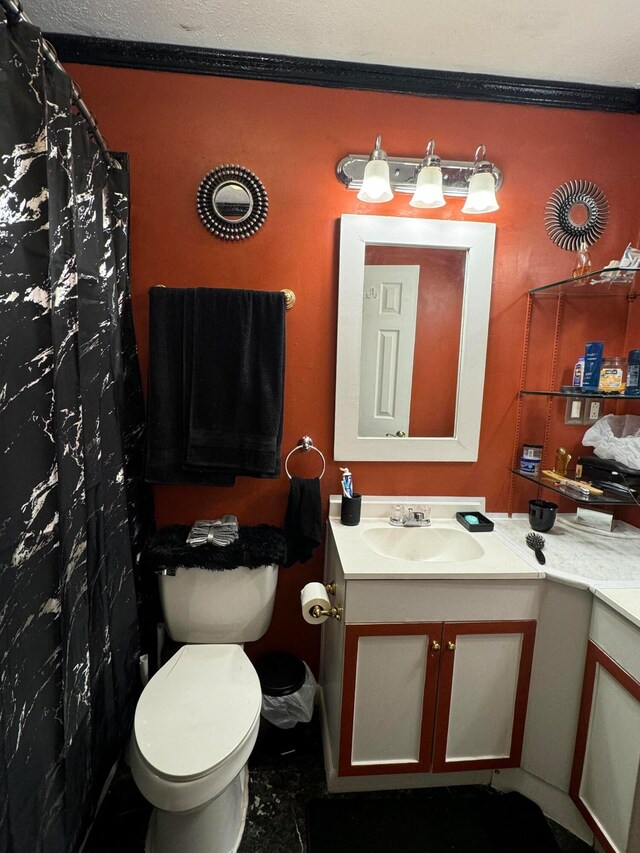 bathroom with vanity, toilet, and a shower with shower curtain