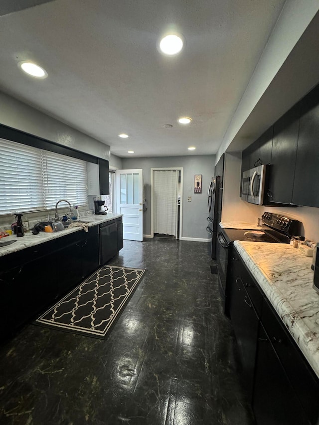 kitchen with sink and appliances with stainless steel finishes