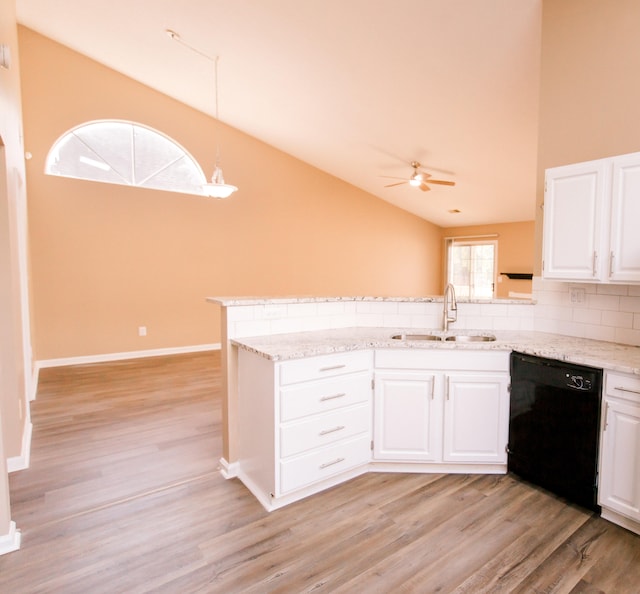 kitchen featuring white cabinetry, kitchen peninsula, sink, and black dishwasher