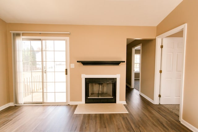 unfurnished living room featuring hardwood / wood-style floors