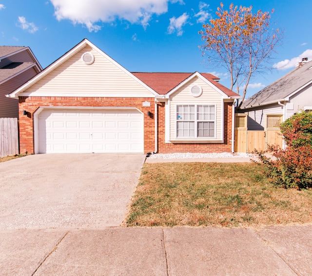 single story home with a garage and a front lawn