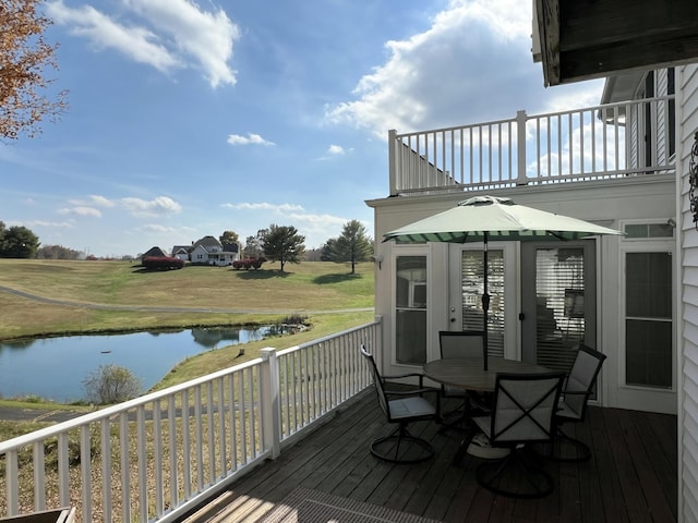 wooden deck with a water view