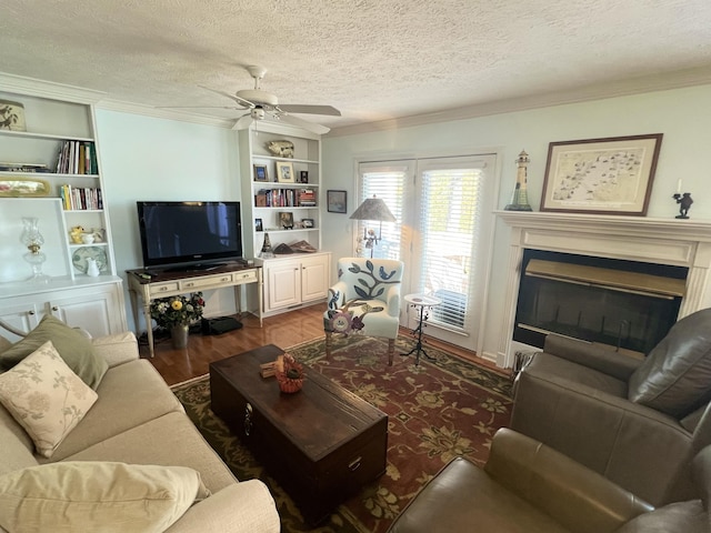 living room featuring crown molding, a textured ceiling, dark wood-type flooring, and ceiling fan