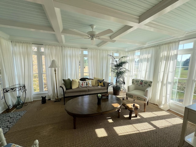 sunroom / solarium with beamed ceiling, coffered ceiling, and ceiling fan