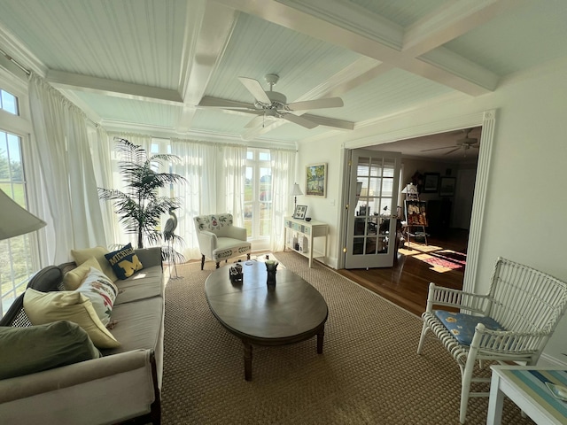 sunroom with beam ceiling, coffered ceiling, and ceiling fan