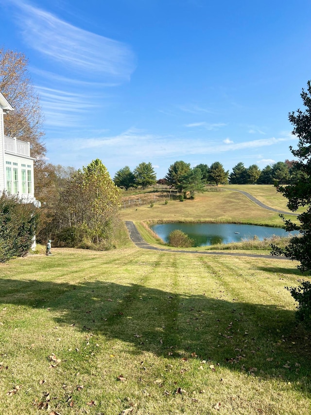 exterior space with a yard and a water view