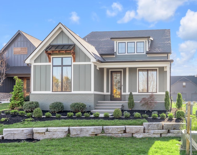 2805 Bobwhite Ct, Lexington, KY 40509 - view of front of property with brick siding, board and batten siding, roof with shingles, and a front yard