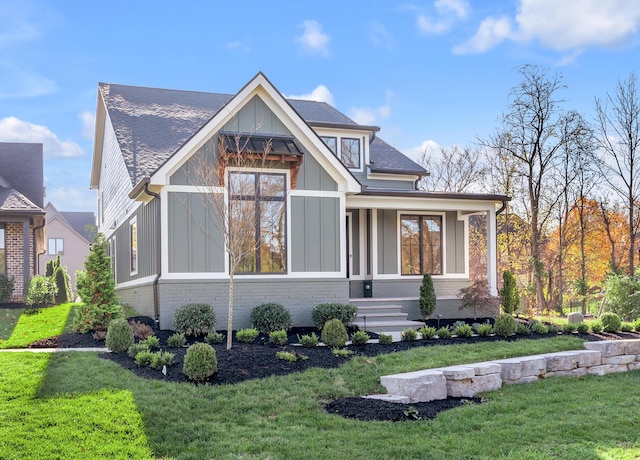 2805 Bobwhite Ct, Lexington, KY 40509 - view of front of home featuring a front yard, board and batten siding, and brick siding