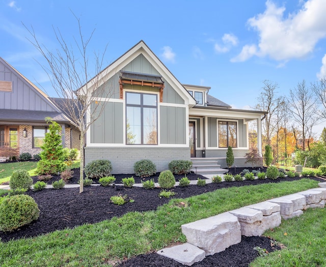 2805 Bobwhite Ct, Lexington, KY 40509 - view of front of house with board and batten siding, brick siding, and a front yard