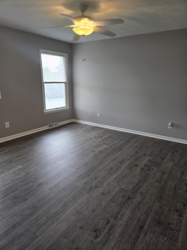 87 Cardinal Cir, Lancaster, KY 40444 - spare room featuring ceiling fan, dark wood-style flooring, and baseboards