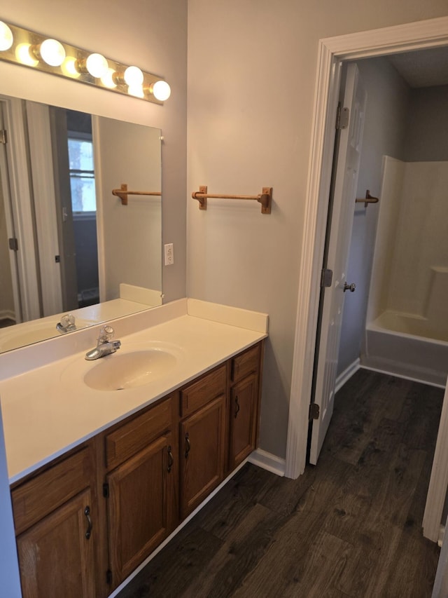 bathroom with vanity and wood-type flooring