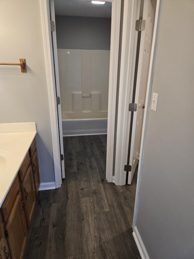 bathroom with vanity and wood-type flooring