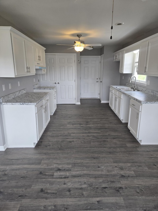 87 Cardinal Cir, Lancaster, KY 40444 - kitchen featuring a sink, a ceiling fan, white cabinets, and baseboards