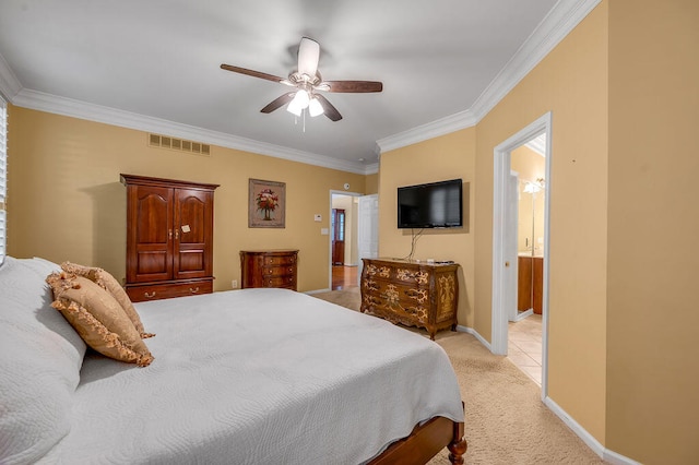 bedroom with ceiling fan, ensuite bath, crown molding, and light colored carpet