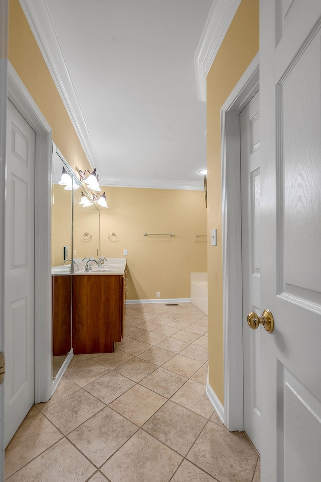 bathroom featuring vanity, tile patterned flooring, and ornamental molding