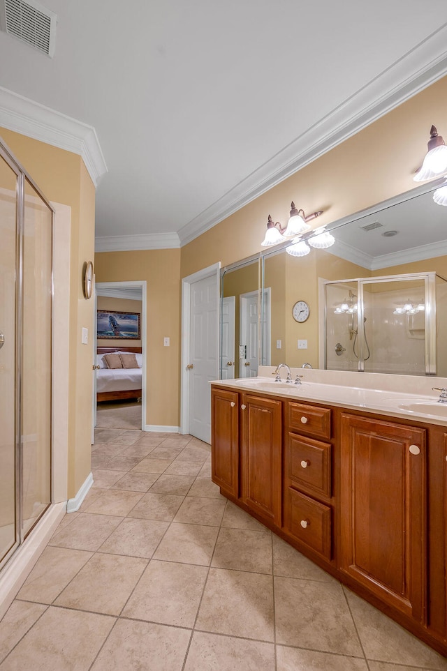 bathroom featuring a shower with shower door, vanity, tile patterned flooring, and ornamental molding