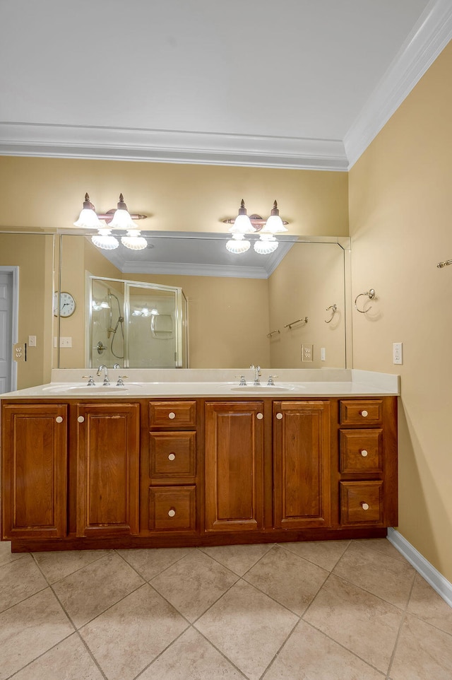 bathroom with vanity, an enclosed shower, tile patterned floors, and crown molding