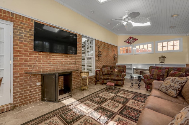 living room featuring wood ceiling, vaulted ceiling, a brick fireplace, ceiling fan, and brick wall