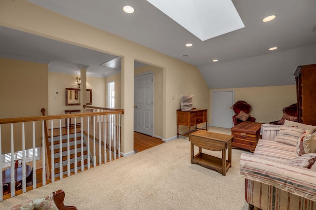 sitting room with vaulted ceiling, light carpet, and crown molding