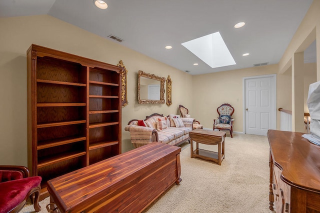 living room with light colored carpet and lofted ceiling with skylight