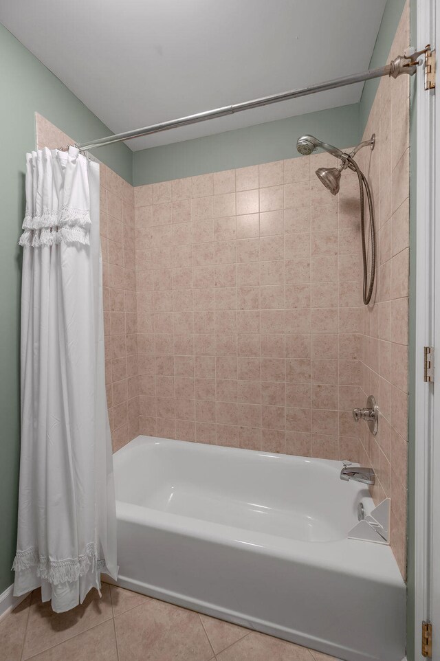 bathroom with shower / bath combo and tile patterned floors