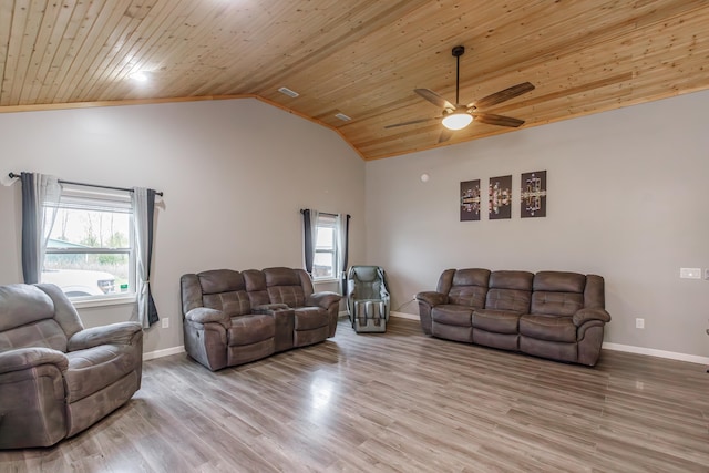 living room featuring ceiling fan, plenty of natural light, light hardwood / wood-style flooring, and wood ceiling