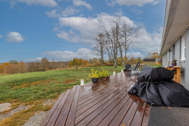 wooden deck featuring a yard