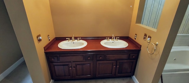 bathroom featuring a bath and vanity