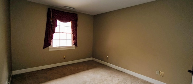 view of carpeted spare room