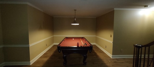 rec room with ornamental molding, billiards, and dark wood-type flooring