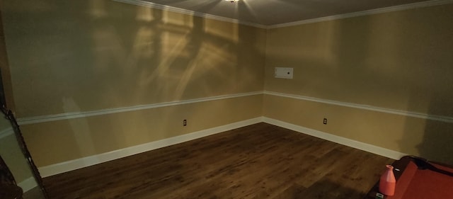 empty room featuring pool table, dark wood-type flooring, and crown molding