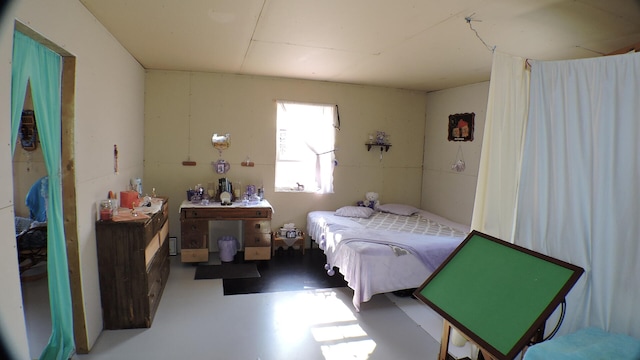 bedroom with concrete flooring