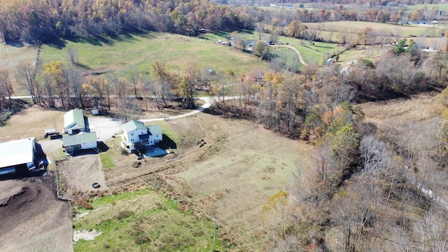 birds eye view of property with a rural view