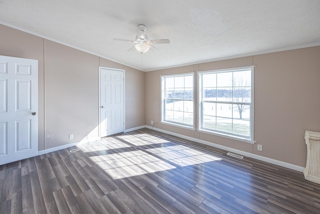 unfurnished bedroom with crown molding, ceiling fan, dark hardwood / wood-style floors, and a textured ceiling