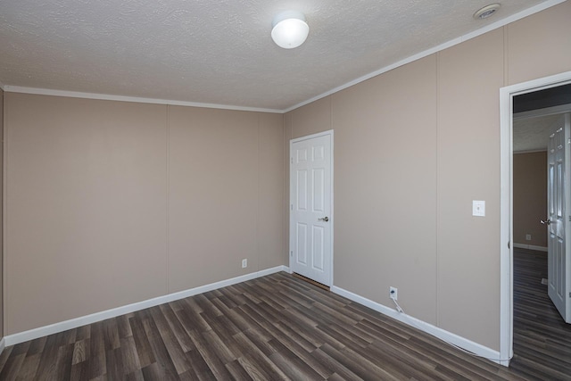 unfurnished bedroom with ornamental molding, dark hardwood / wood-style flooring, and a textured ceiling