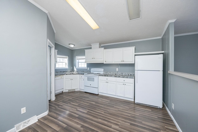 kitchen with vaulted ceiling, white cabinets, white appliances, dark wood-type flooring, and a textured ceiling