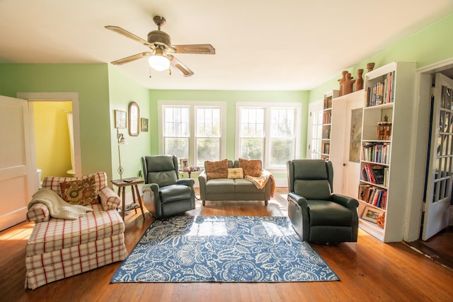 living room with hardwood / wood-style floors and ceiling fan