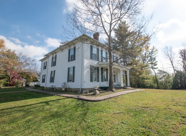 view of home's exterior featuring a lawn