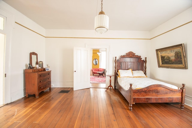 bedroom with hardwood / wood-style flooring