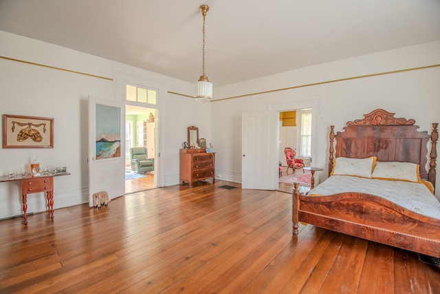 bedroom with hardwood / wood-style flooring