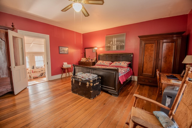 bedroom with light hardwood / wood-style flooring and ceiling fan