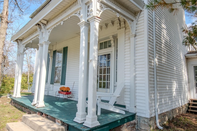 view of exterior entry with a porch