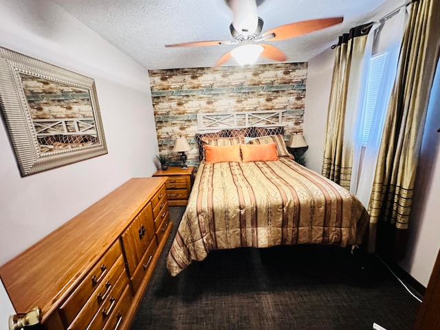 bedroom featuring a textured ceiling and ceiling fan