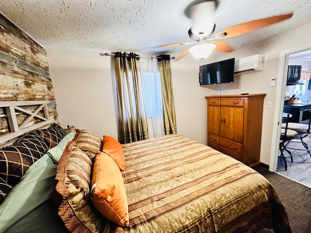 carpeted bedroom with a wall unit AC, a textured ceiling, and ceiling fan