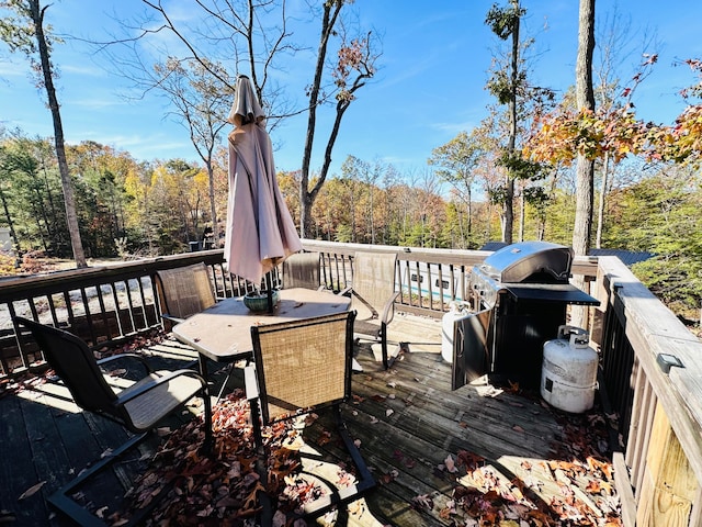 wooden deck featuring area for grilling